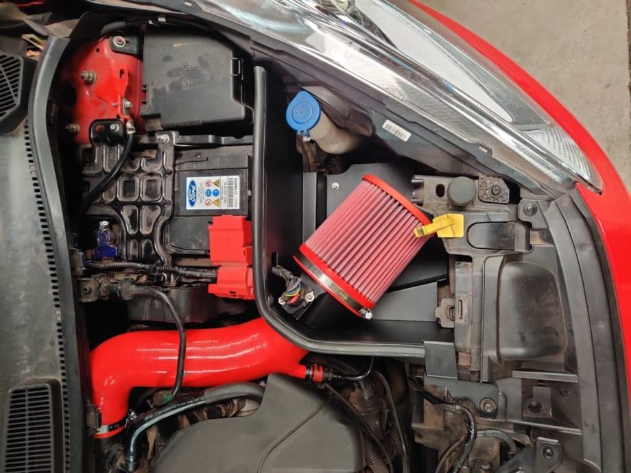 cone air filter installed in engine compartment